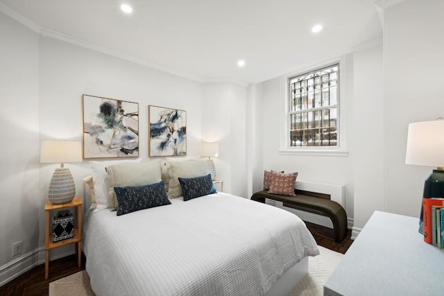 bedroom featuring crown molding and hardwood / wood-style floors