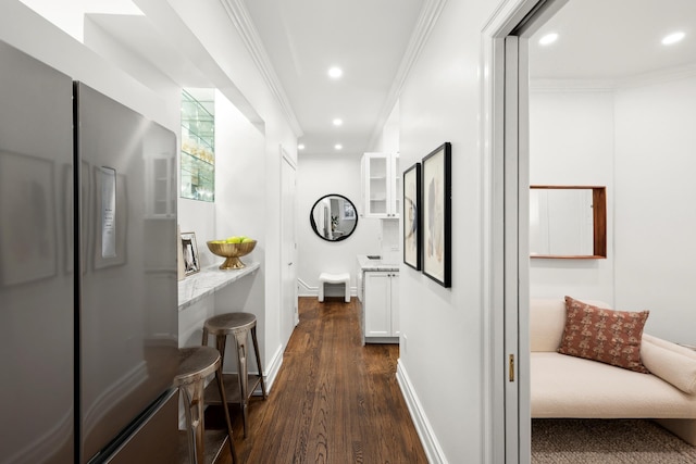 living area featuring crown molding and hardwood / wood-style floors