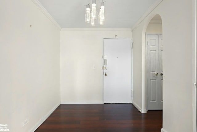 interior space with ornamental molding and dark hardwood / wood-style floors