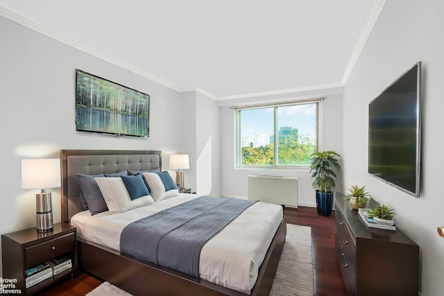 bedroom featuring crown molding, radiator, and dark wood-type flooring