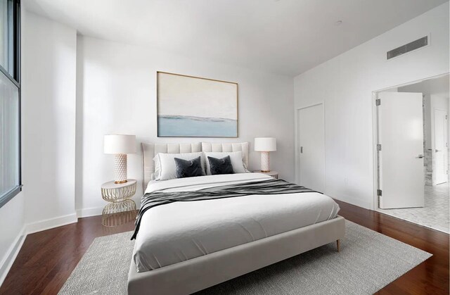 bedroom featuring dark hardwood / wood-style flooring