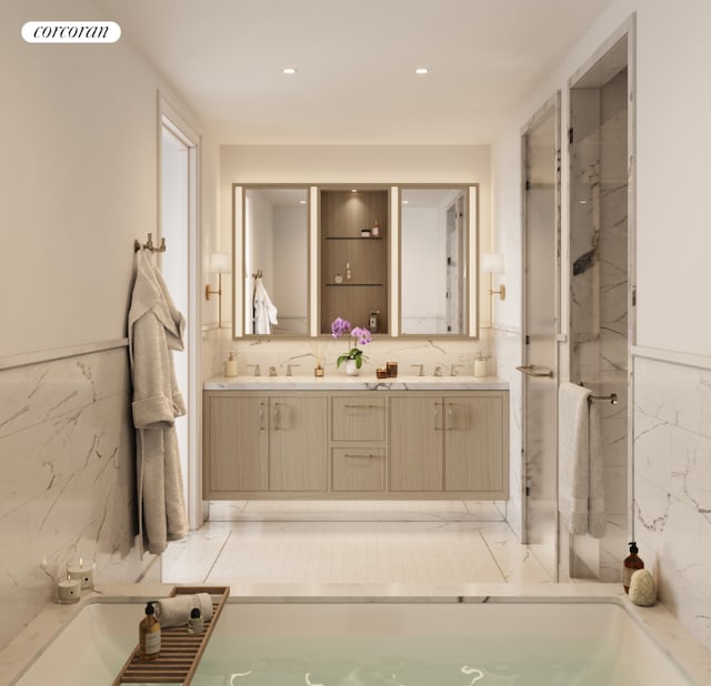 bathroom featuring vanity, tile walls, and a shower