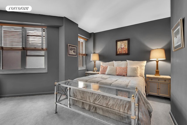 carpeted bedroom featuring visible vents and baseboards