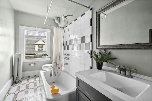 bathroom featuring shower / bath combo with shower curtain, vanity, radiator heating unit, and toilet