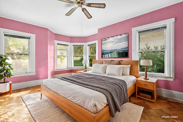 bedroom featuring baseboards and a ceiling fan