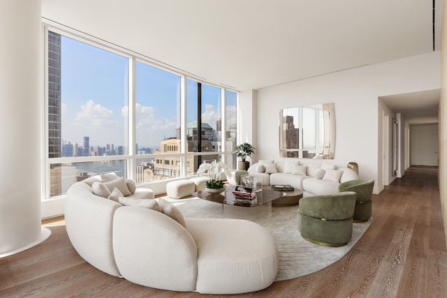 living room with a view of city and wood finished floors