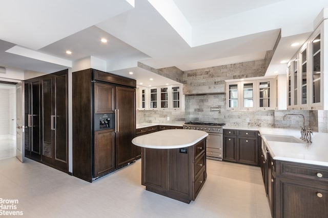 60 Sutton Pl S Unit Ph19S, New York City, NY 10022 - kitchen featuring high end appliances, a sink, backsplash, a kitchen island, and light countertops