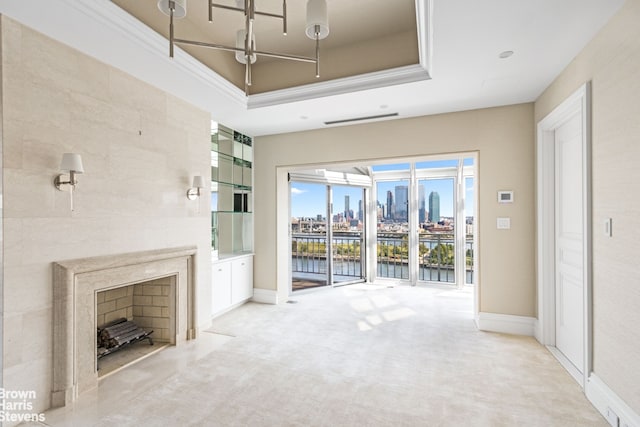 60 Sutton Pl S Unit Ph19S, New York City, NY 10022 - unfurnished living room featuring a water view, light colored carpet, baseboards, and a raised ceiling