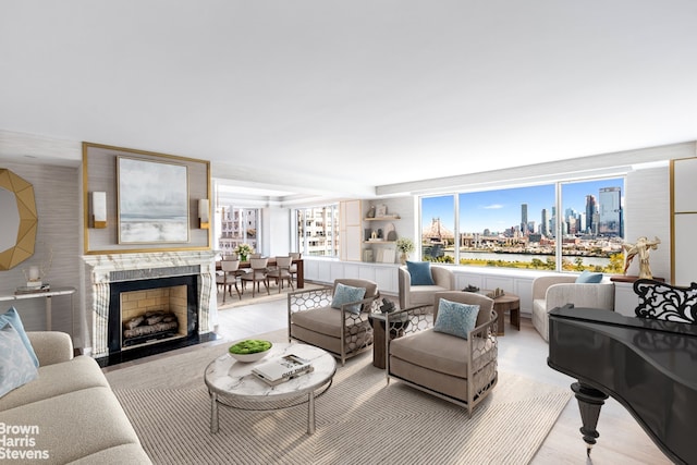 living area featuring a view of city and a fireplace with flush hearth