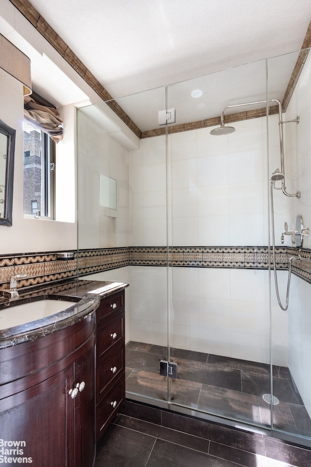 60 Sutton Pl S Unit Ph19S, New York City, NY 10022 - full bathroom featuring vanity, a shower stall, tile patterned floors, and tile walls