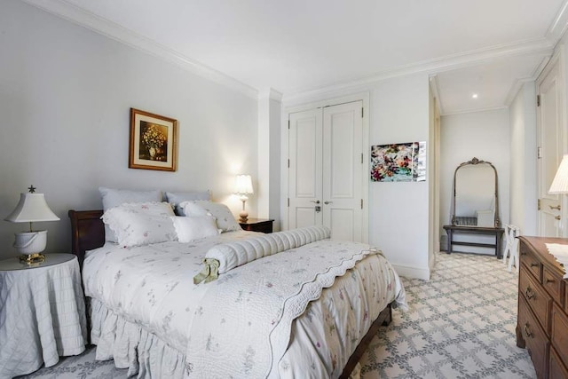 bedroom featuring a closet, crown molding, light colored carpet, and baseboards