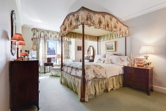 bedroom featuring carpet, crown molding, and baseboards
