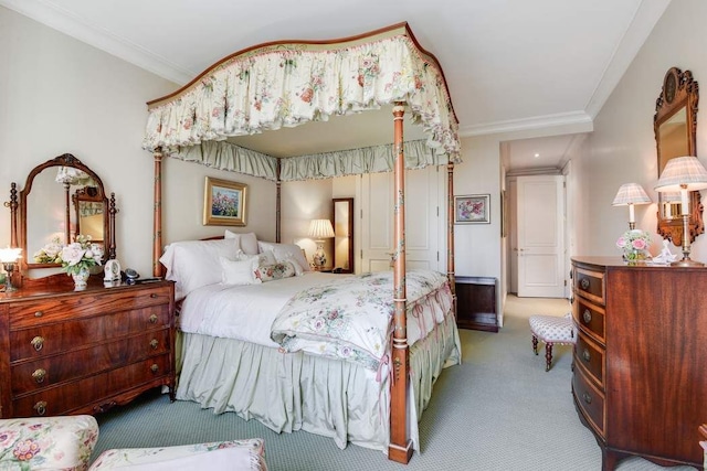 bedroom with carpet flooring and ornamental molding