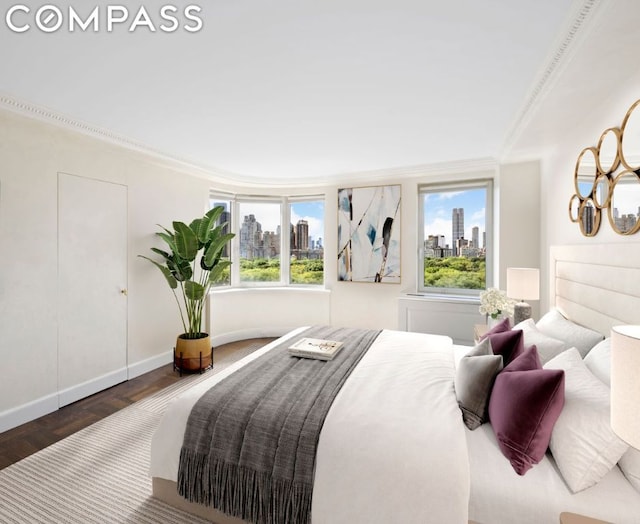 bedroom with multiple windows, ornamental molding, and dark hardwood / wood-style floors