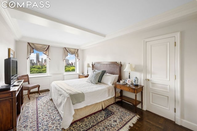 bedroom featuring crown molding and dark parquet floors