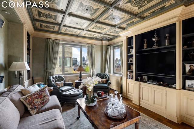 living room with coffered ceiling, ornamental molding, wood-type flooring, and built in features