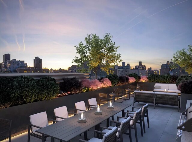 540 6th Ave Unit 11A, New York City, NY 10011 - patio terrace at dusk featuring outdoor lounge area, a patio, a view of skyline, and outdoor dining area