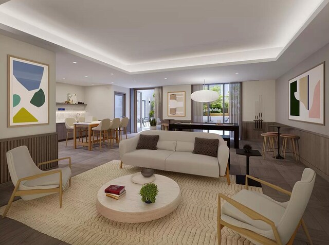 540 6th Ave Unit 11A, New York City, NY 10011 - living area featuring wainscoting, a raised ceiling, and recessed lighting