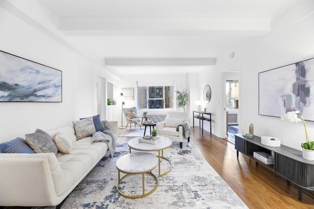 living area featuring wood finished floors and beam ceiling