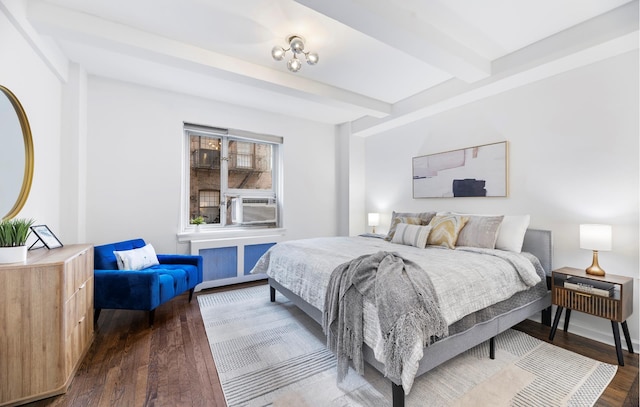 bedroom with cooling unit, beam ceiling, and dark wood-style flooring
