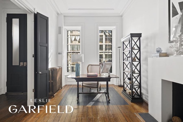 office area with wood-type flooring and ornamental molding