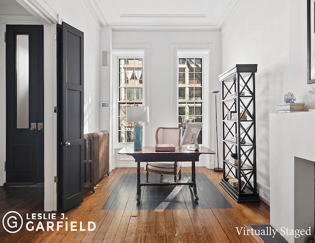 home office featuring radiator heating unit and dark hardwood / wood-style floors