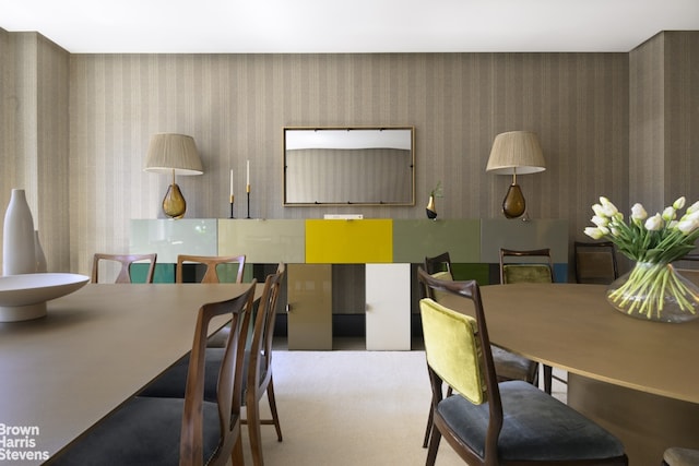 dining area featuring wallpapered walls