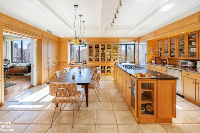 kitchen with beamed ceiling, a sink, coffered ceiling, stainless steel appliances, and glass insert cabinets