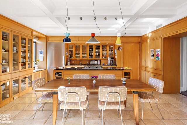 kitchen featuring glass insert cabinets, beam ceiling, coffered ceiling, and dark countertops