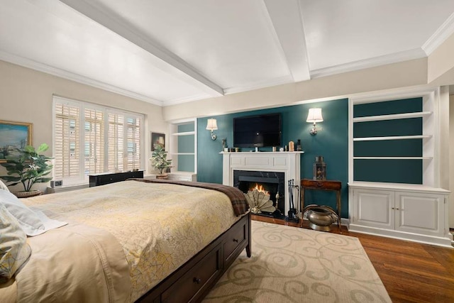 bedroom with dark hardwood / wood-style flooring, ornamental molding, a fireplace, and beam ceiling