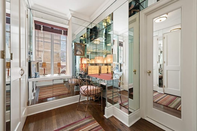 interior space featuring hardwood / wood-style flooring and crown molding