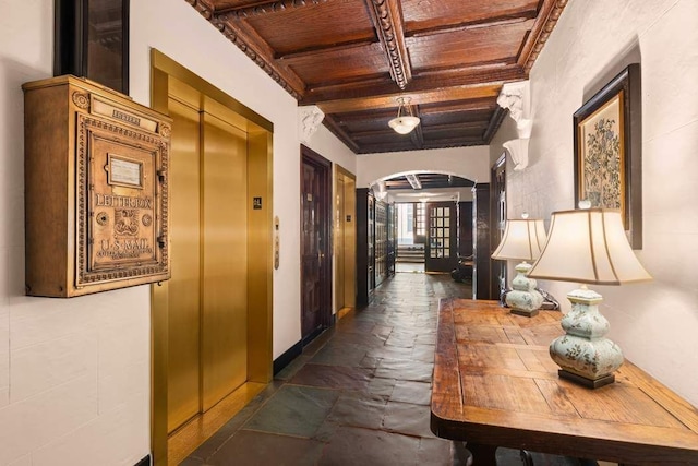 hallway with beamed ceiling, coffered ceiling, elevator, and wooden ceiling