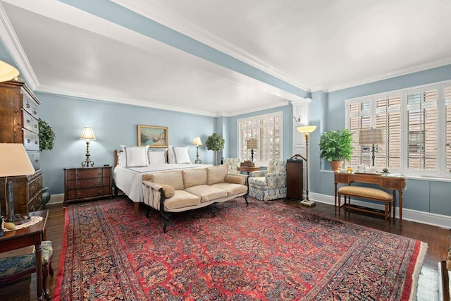 bedroom with baseboards, wood finished floors, and crown molding