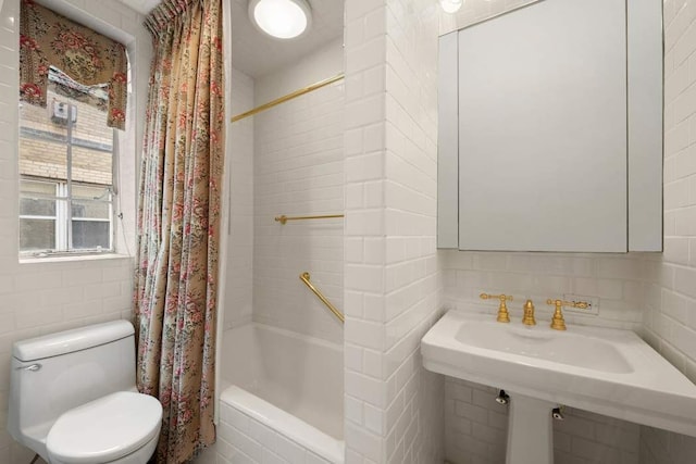 full bath with backsplash, tiled shower / bath combo, tile walls, and toilet