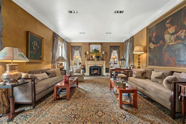 living room featuring a warm lit fireplace and crown molding