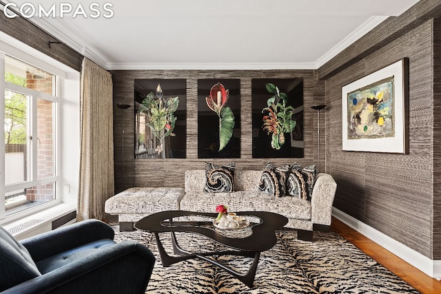 sitting room featuring hardwood / wood-style flooring and crown molding