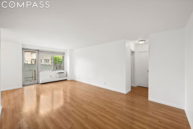 unfurnished living room featuring hardwood / wood-style floors