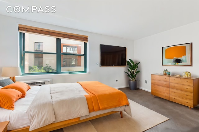 bedroom featuring baseboards and carpet floors