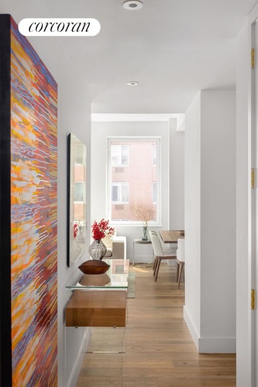 hall with light hardwood / wood-style floors