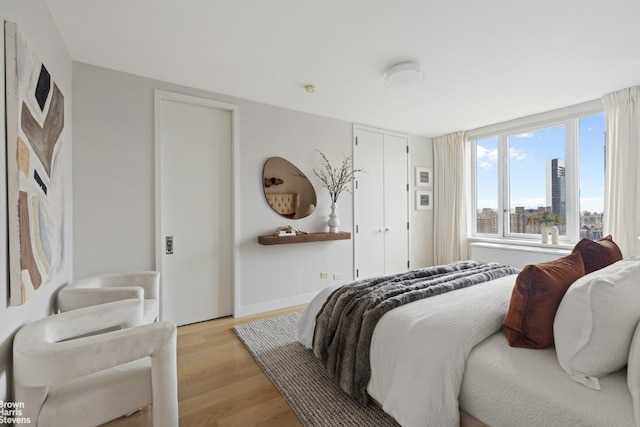 bedroom with light hardwood / wood-style flooring