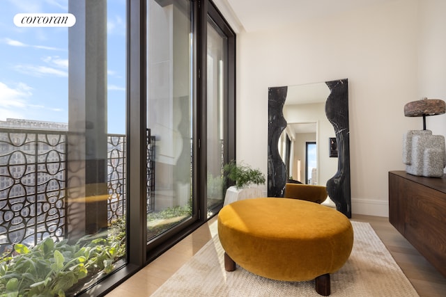 interior space featuring baseboards and wood finished floors