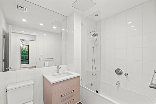 bathroom featuring visible vents, vanity, toilet, recessed lighting, and shower / washtub combination
