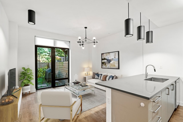 living room with a chandelier and light wood-style floors