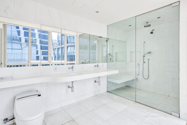 full bathroom with toilet, a stall shower, tile walls, and vanity