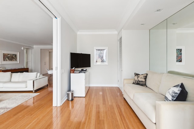 641 5th Ave Unit 27C, New York City, NY 10022 - living room featuring ornamental molding, light wood-type flooring, and baseboards