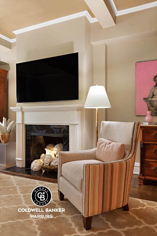 sitting room with dark hardwood / wood-style flooring, crown molding, and a fireplace