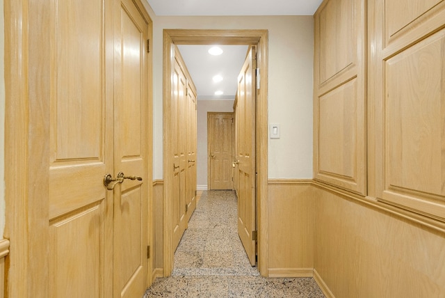 7020 108th St Unit 7E/F, New York City, NY 11375 - hall with baseboards, dark aggregate flooring, a wainscoted wall, and recessed lighting