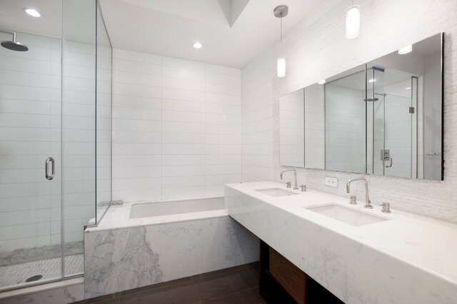 243 W 60th St Unit 3A, New York City, NY 10023 - full bathroom with a shower stall, a bath, double vanity, recessed lighting, and tile patterned flooring