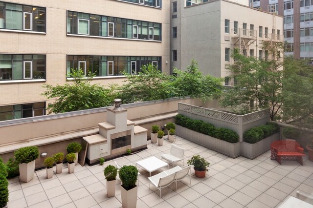 view of home's community with a patio area