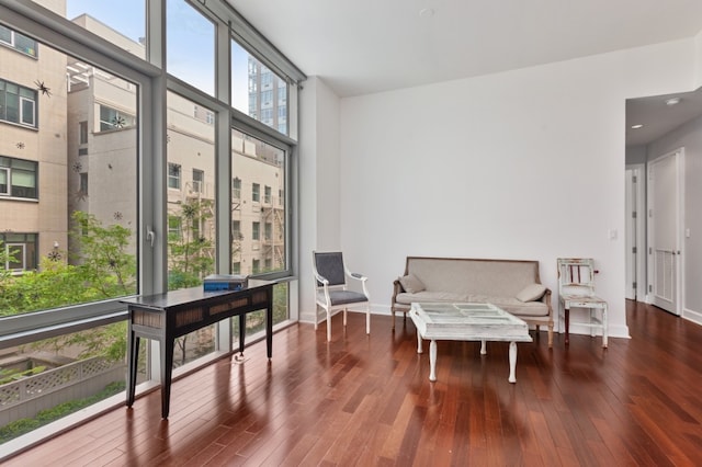 243 W 60th St Unit 3A, New York City, NY 10023 - living area featuring wood finished floors, baseboards, recessed lighting, and floor to ceiling windows